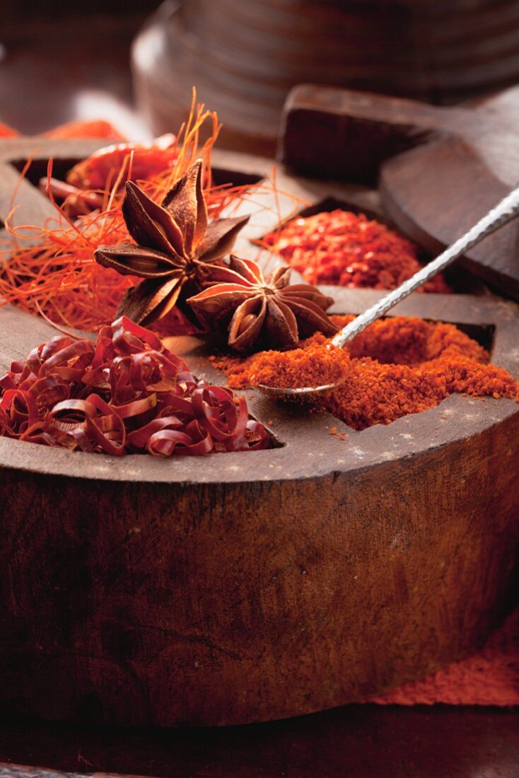 An arrangement of spices featuring dried chillis and star anise