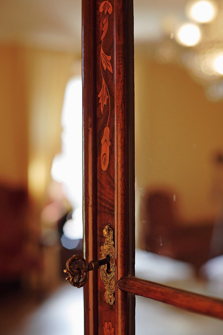 Wood frame of antique glass door with inlay work and brass lock (Schloss Schauenstein)