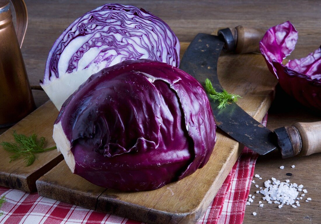 A red cabbage and a curved chopping knife
