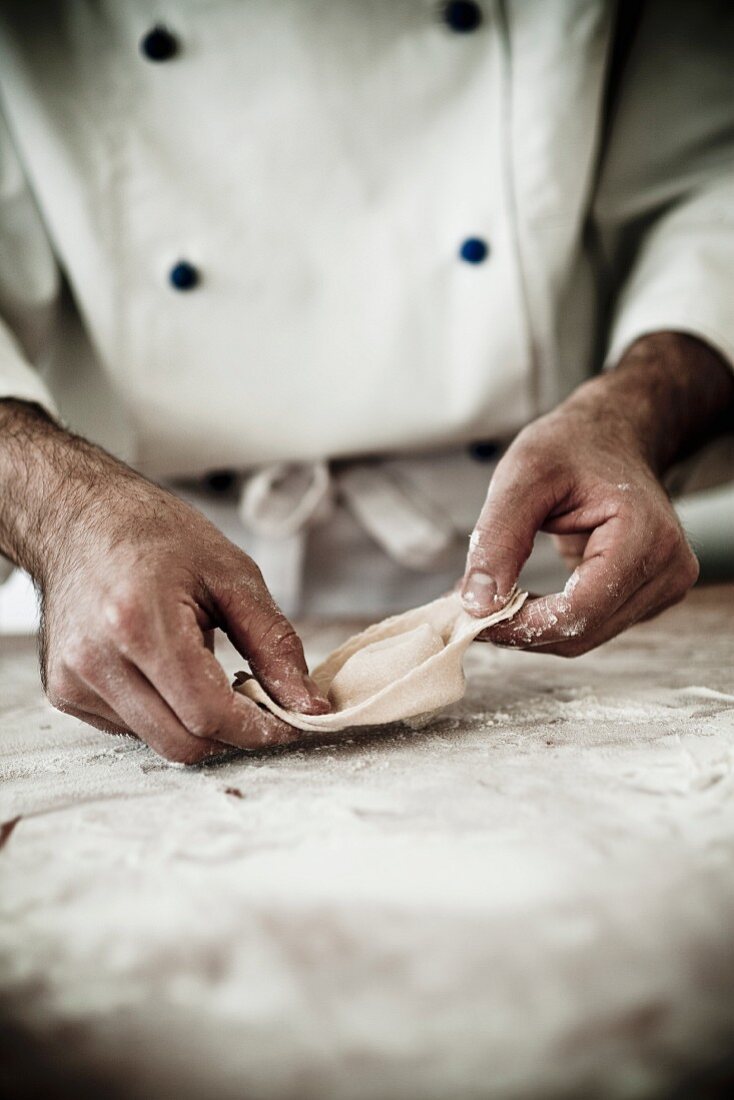 A chef making a tortellino