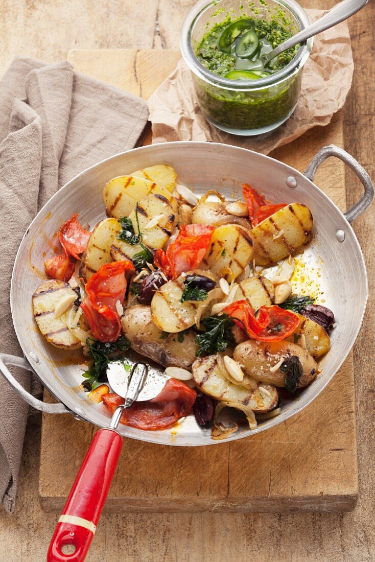Fried potatoes with chorizo and salsa verde