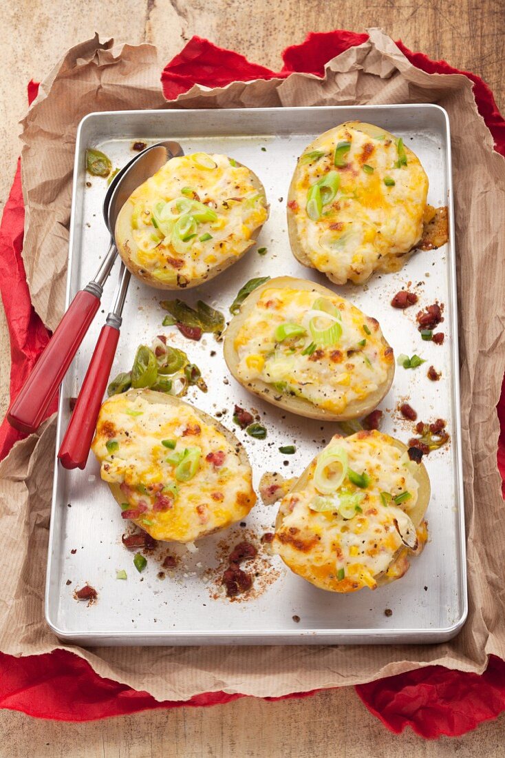 Stuffed potato skins topped with melted cheese