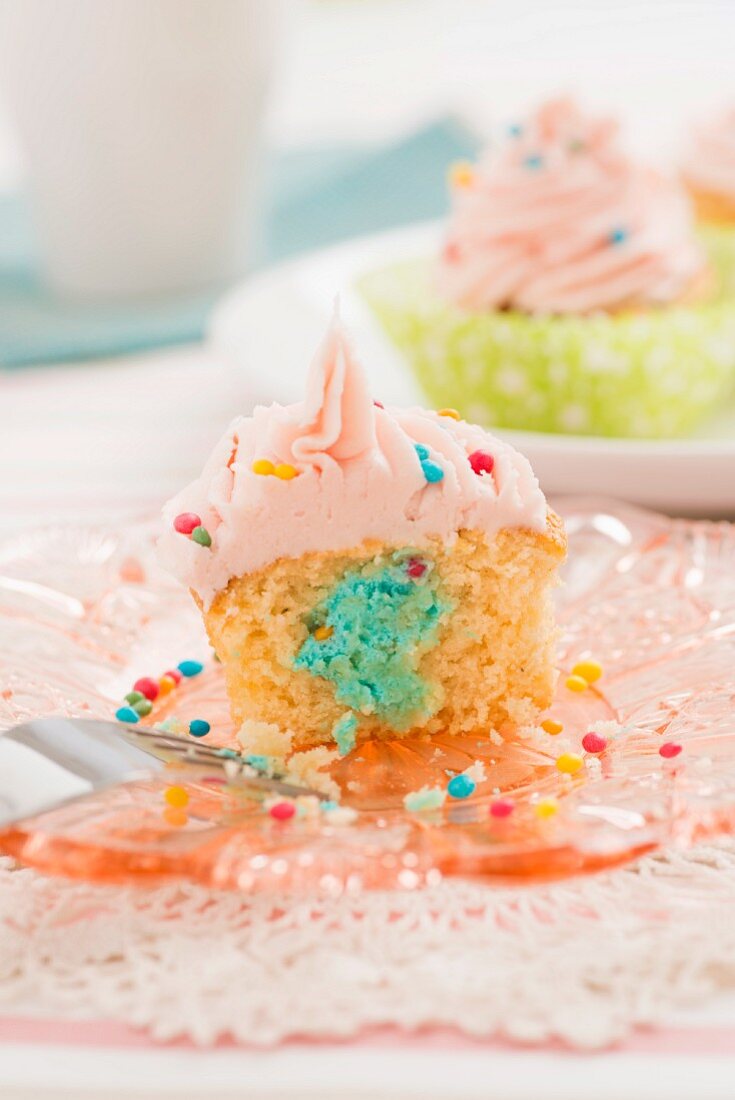 Cupcake with a mascarpone and cream filling and strawberry icing