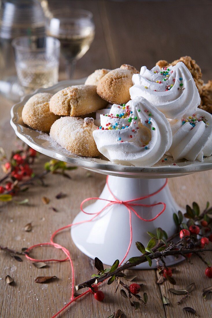 Almond biscuits and meringues with sugar sprinkles