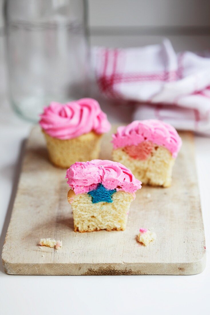 Cupcakes with a blue star inside and pink icing
