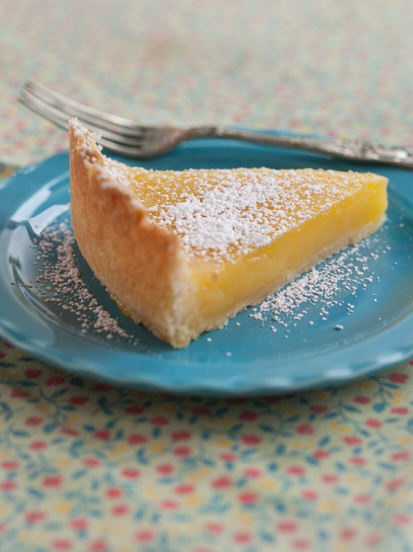 A Slice of Lemon Tart with Powdered Sugar