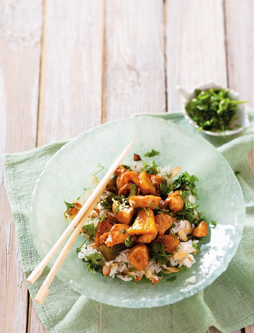 Pieces of chicken with pineapple, lemon sauce and basmati rice