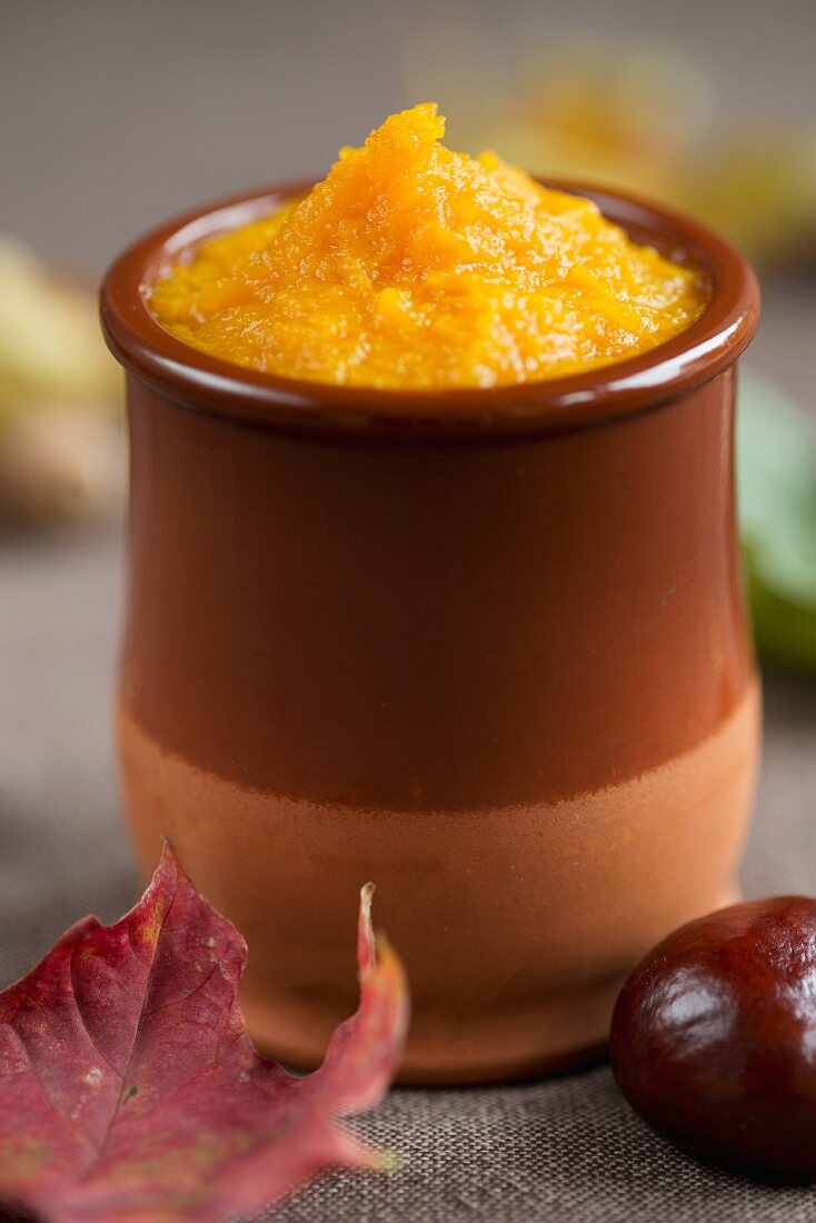 Pumpkin purée in a small clay pot
