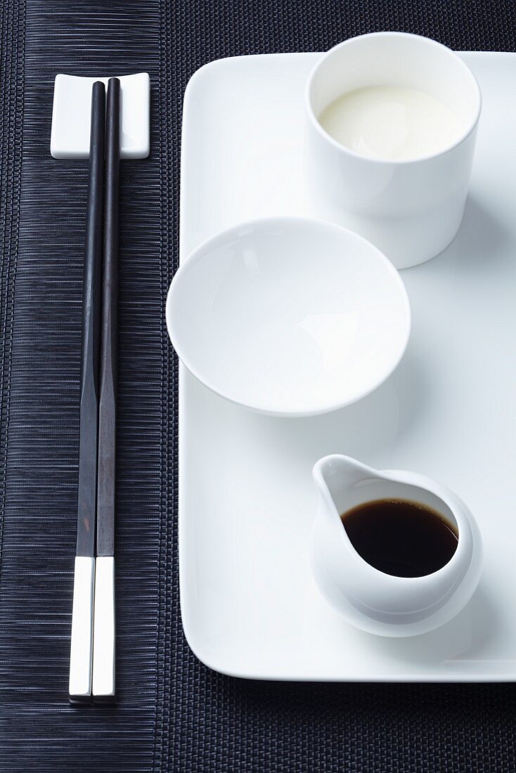 Asian tableware with soy sauce and Japanese mayonnaise