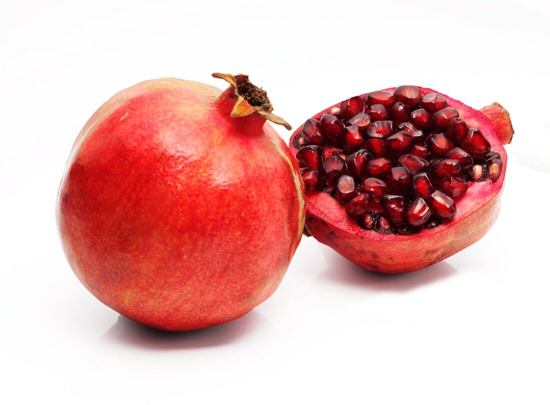 A whole and half pomegranate