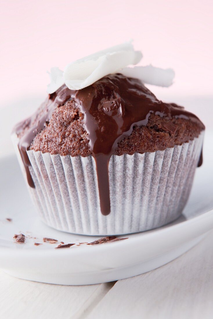Chocolate muffin topped with white chocolate curls