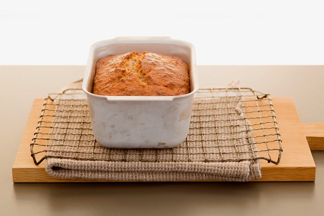Freshly baked banana bread in a loaf tin