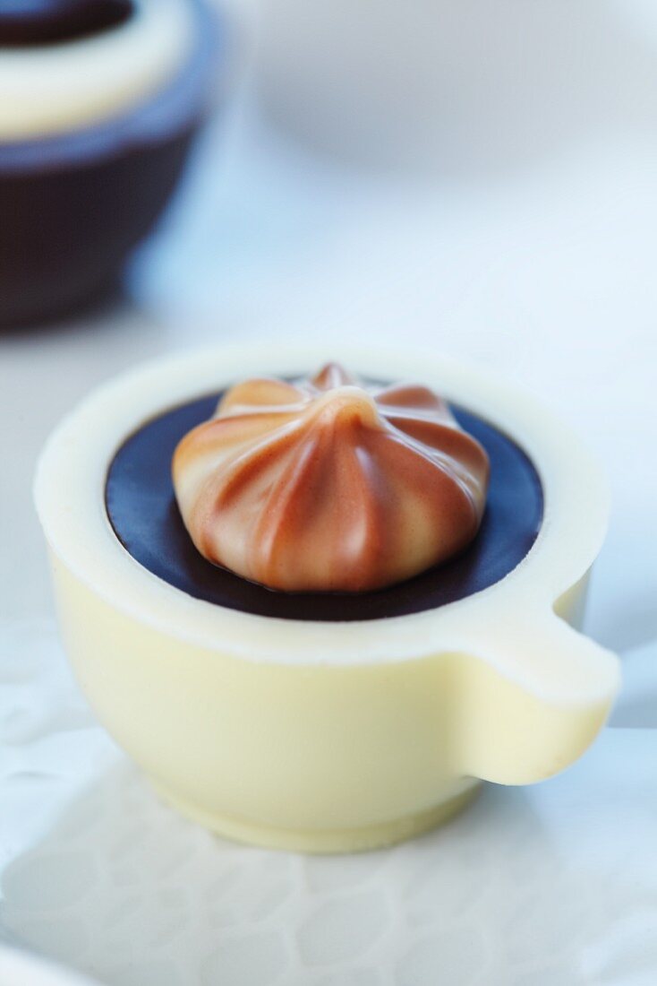 A chocolate in the shape of a coffee cup