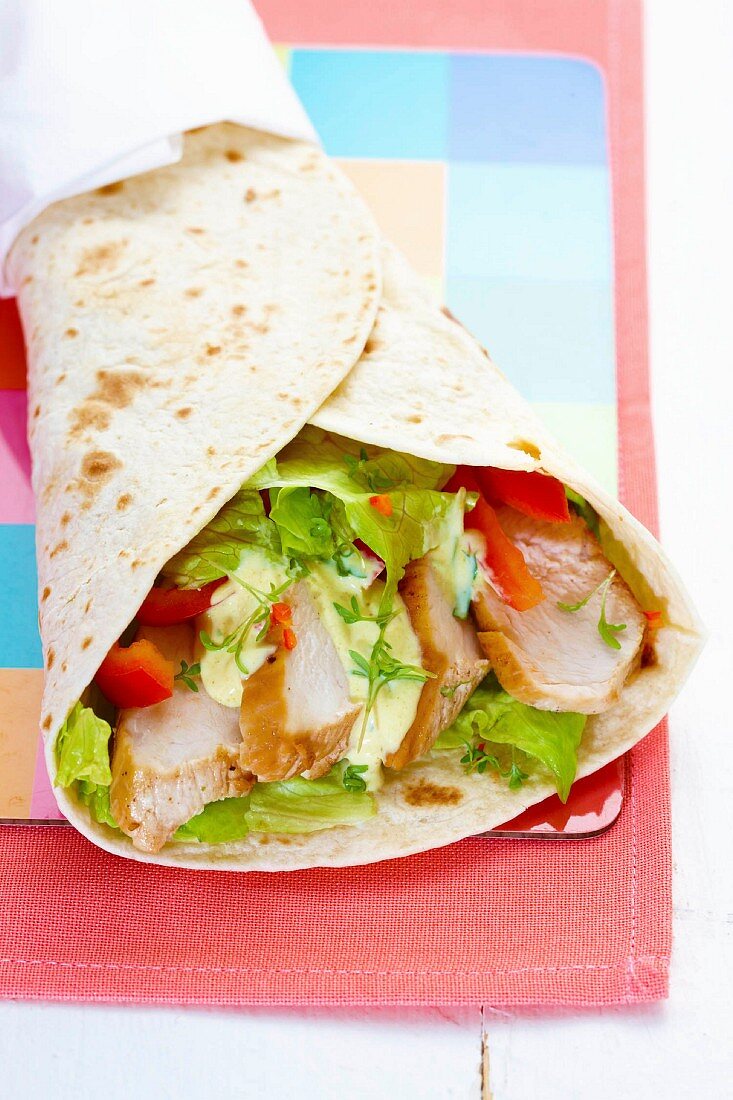 Chicken, salad and tomato wrap