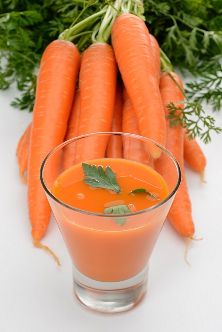 A glass of fresh carrot juice