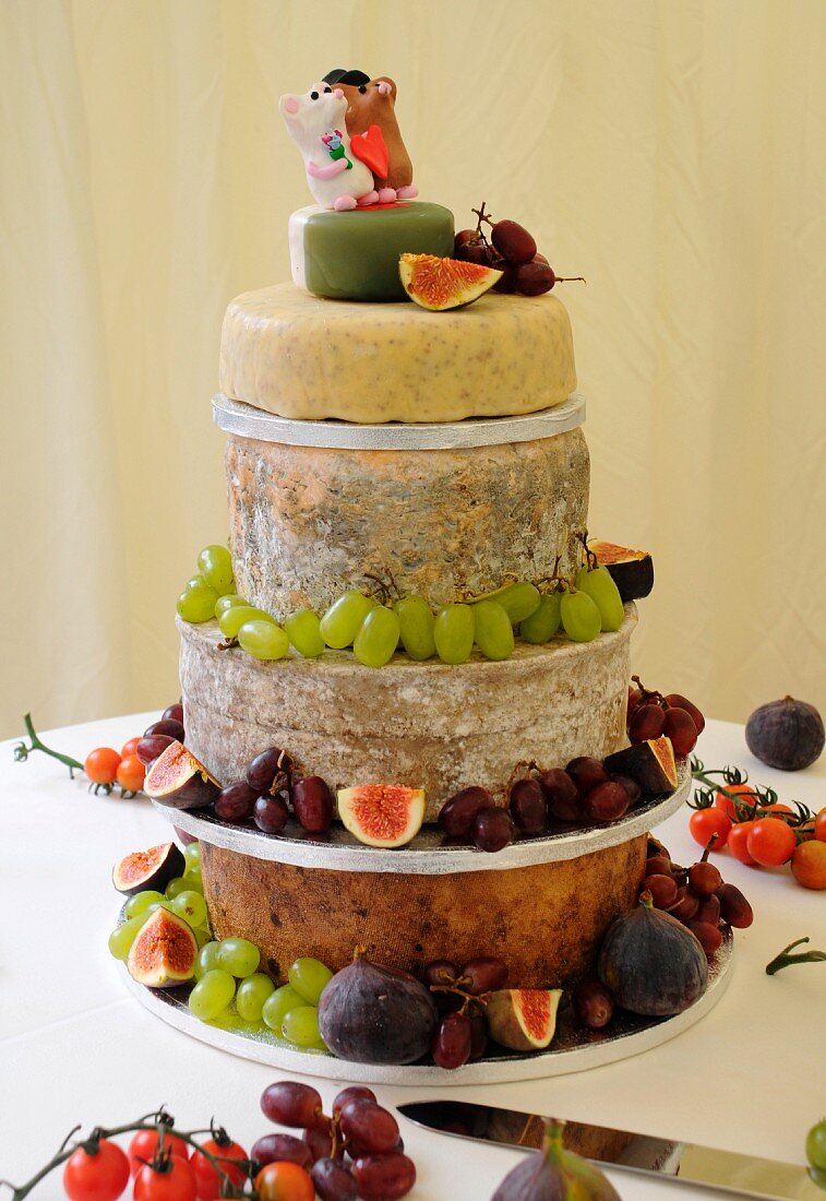 A wedding cake of cheese with fruit