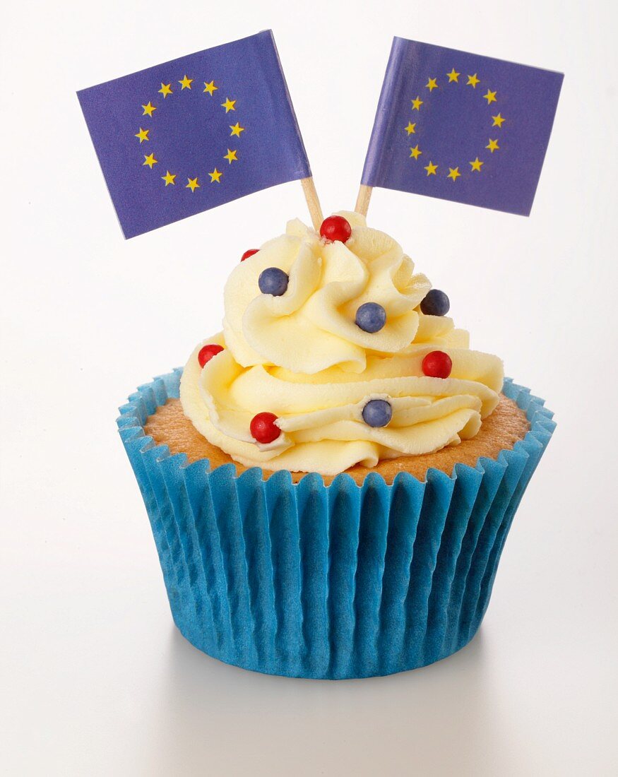 A cupcake decorated with buttercream and EU flags