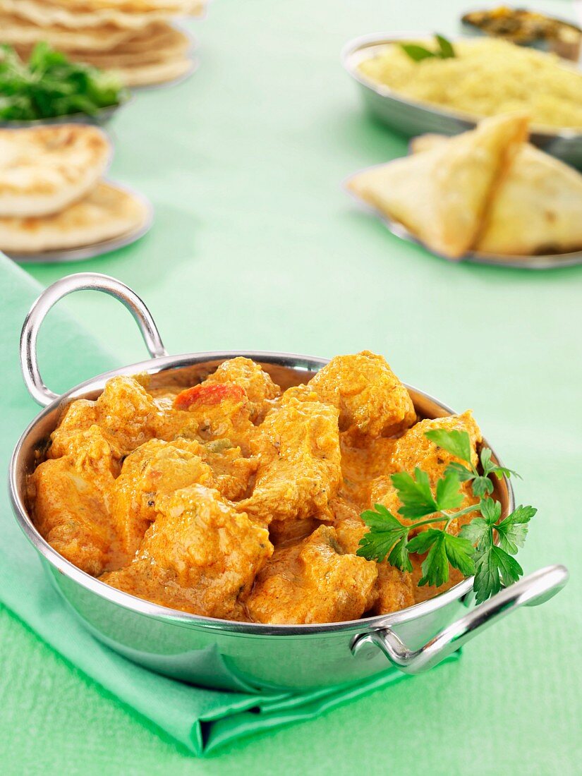 Chicken korma with samosas and naan bread (India)