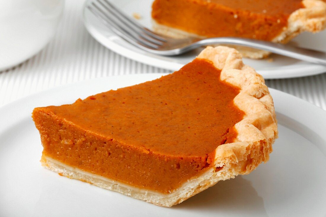 Two slices of pumpkin pie