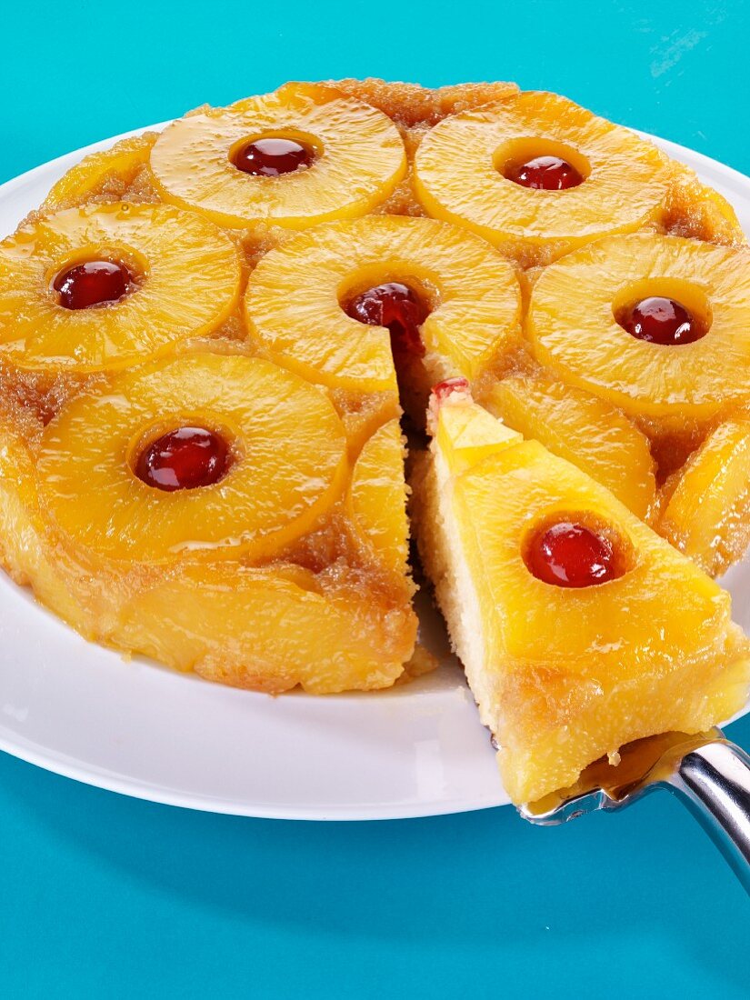Pineapple upside-down cake, a piece on server