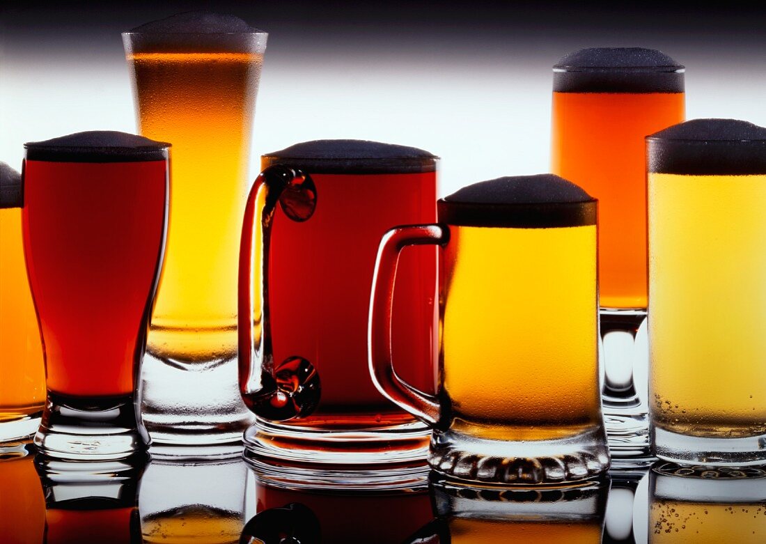 An assortment of (full) beer glasses and tankards