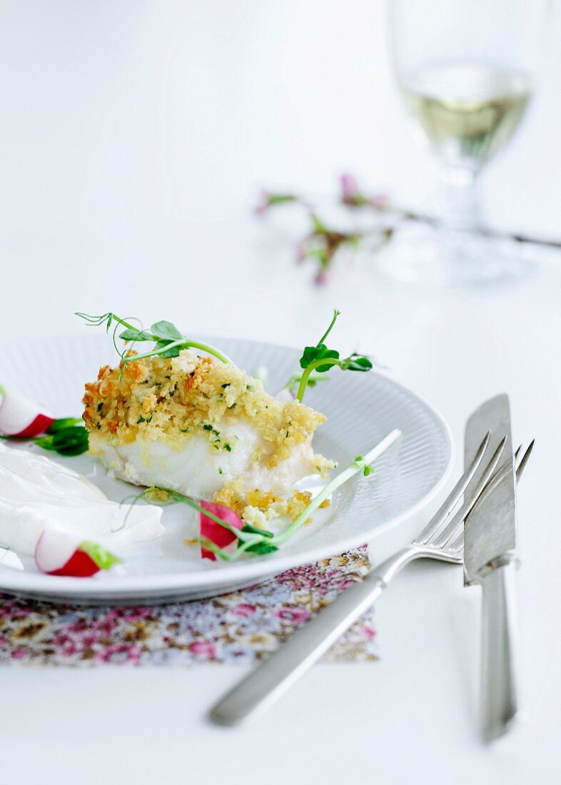 Fish with a crispy topping, radishes and watercress