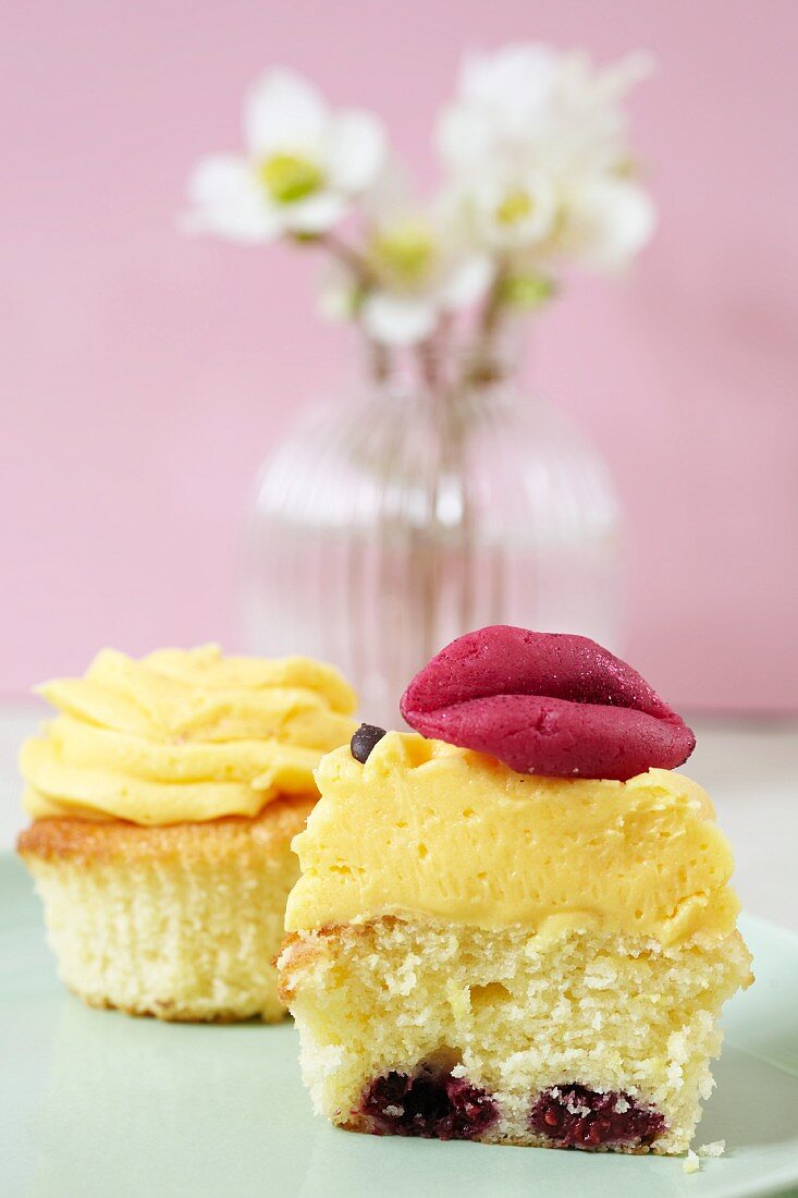 A cupcake topped with set custard and marzipan lips