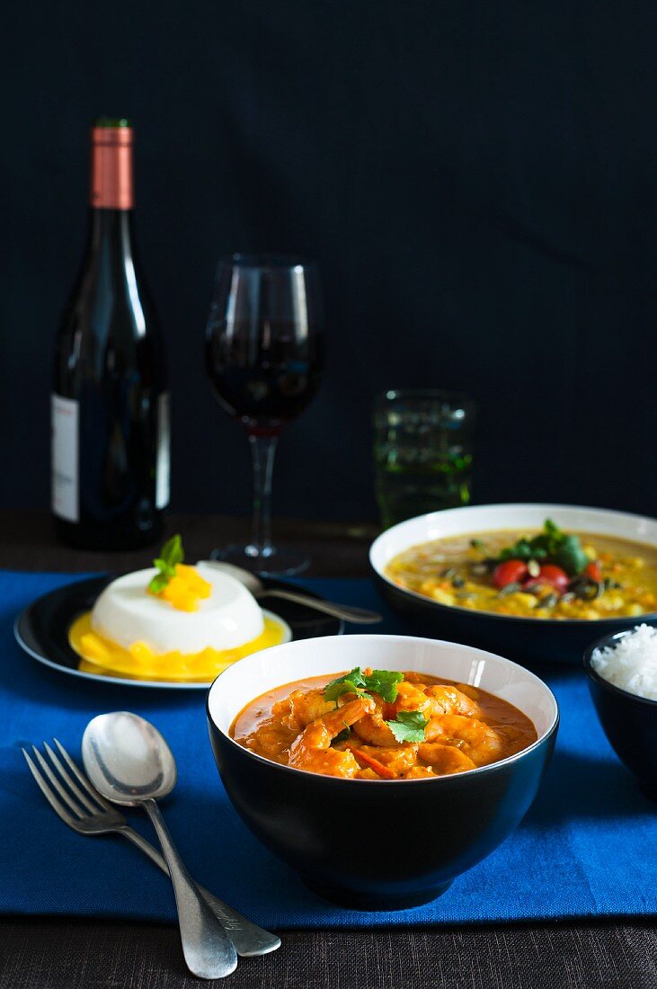 A menu of prawn curry, lentil soup and mango panna cotta