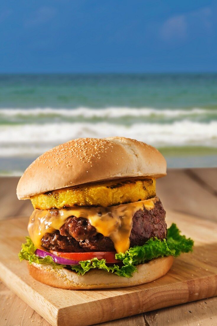 Cheeseburger with Tomatoes, Red Onion, Lettuce and Grilled Pineapple; By the Beach