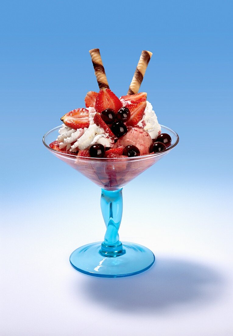 Strawberry ice cream with cream, strawberries and Amarena cherries