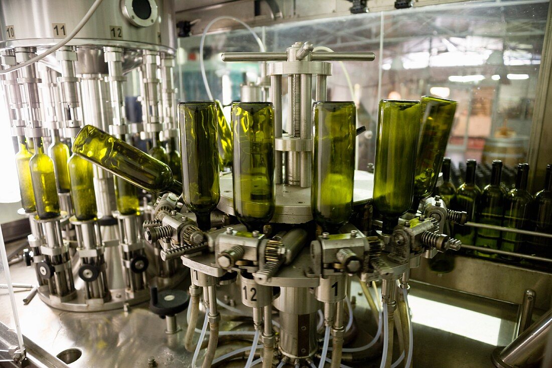 Bottles being filled with wine