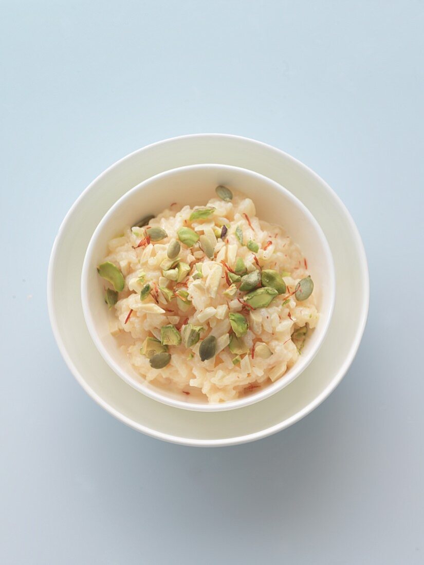 A Bowl of Saffron Rice Pudding with Pistachios; From Above