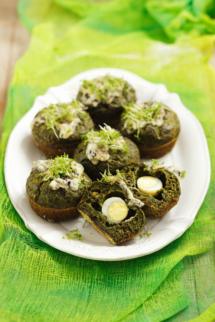 Spinach muffins with quail's egg and cress