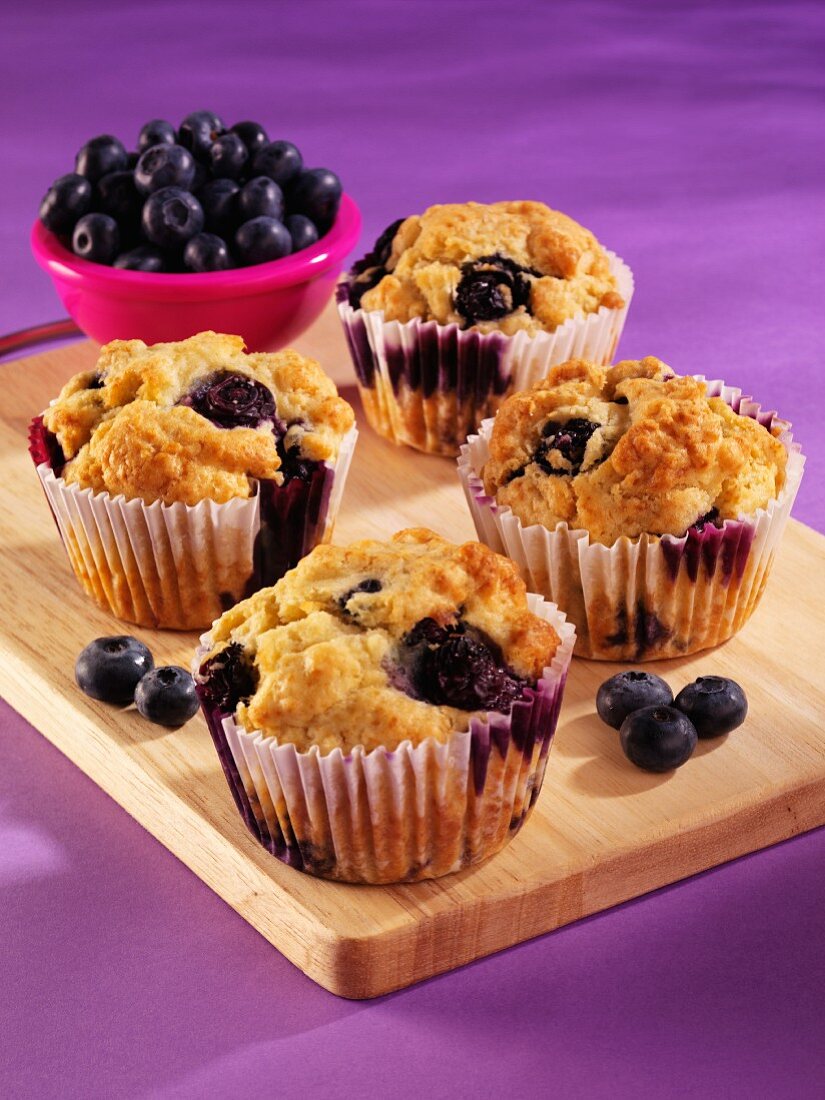 Blueberry muffins and fresh blueberries