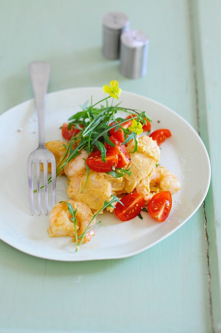 Prawns in egg, tossed with fresh tomatoes and rocket