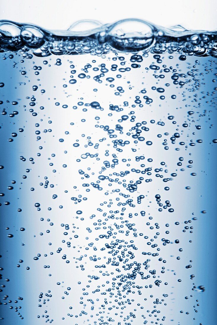 Air bubbles rising through water (close-up)