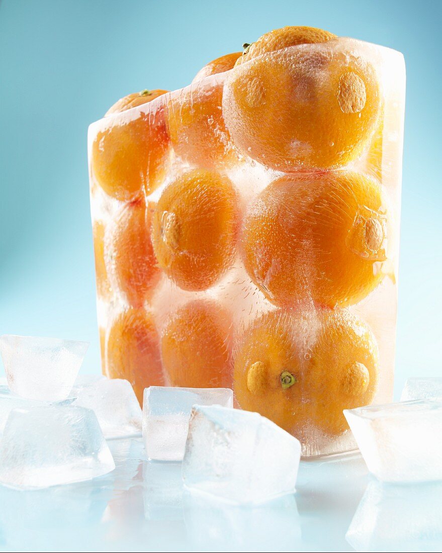 Whole Oranges Frozen in a Block of Ice