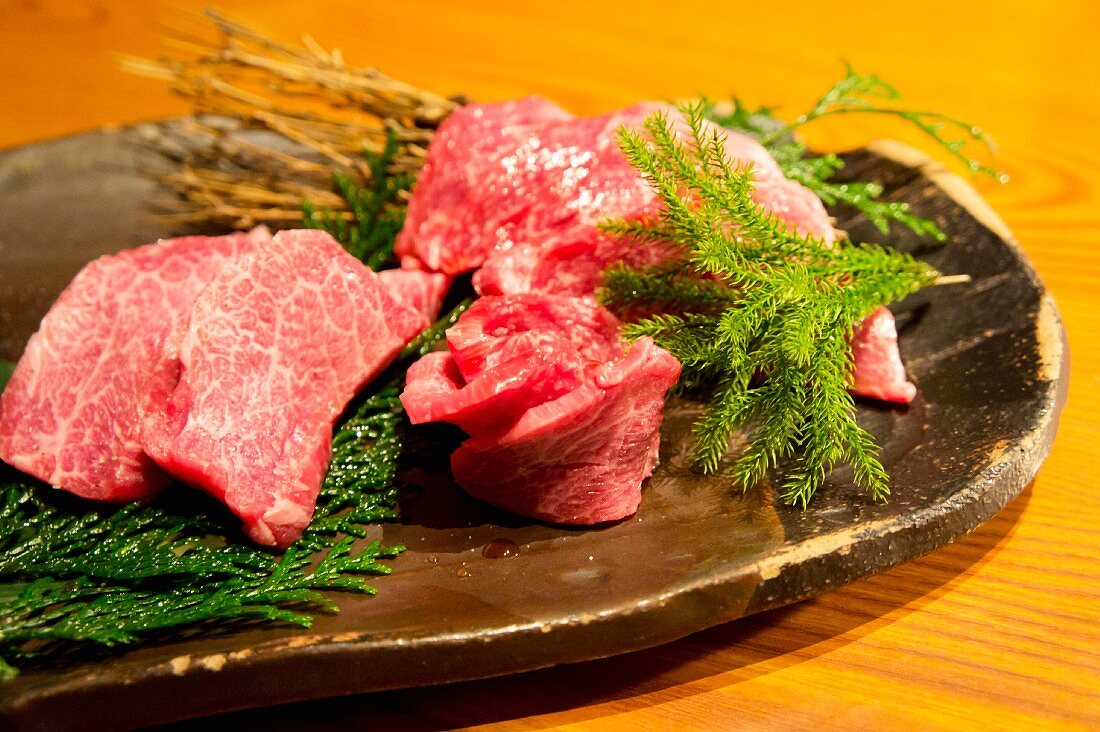 Raw Wagyu beef on a stone platter