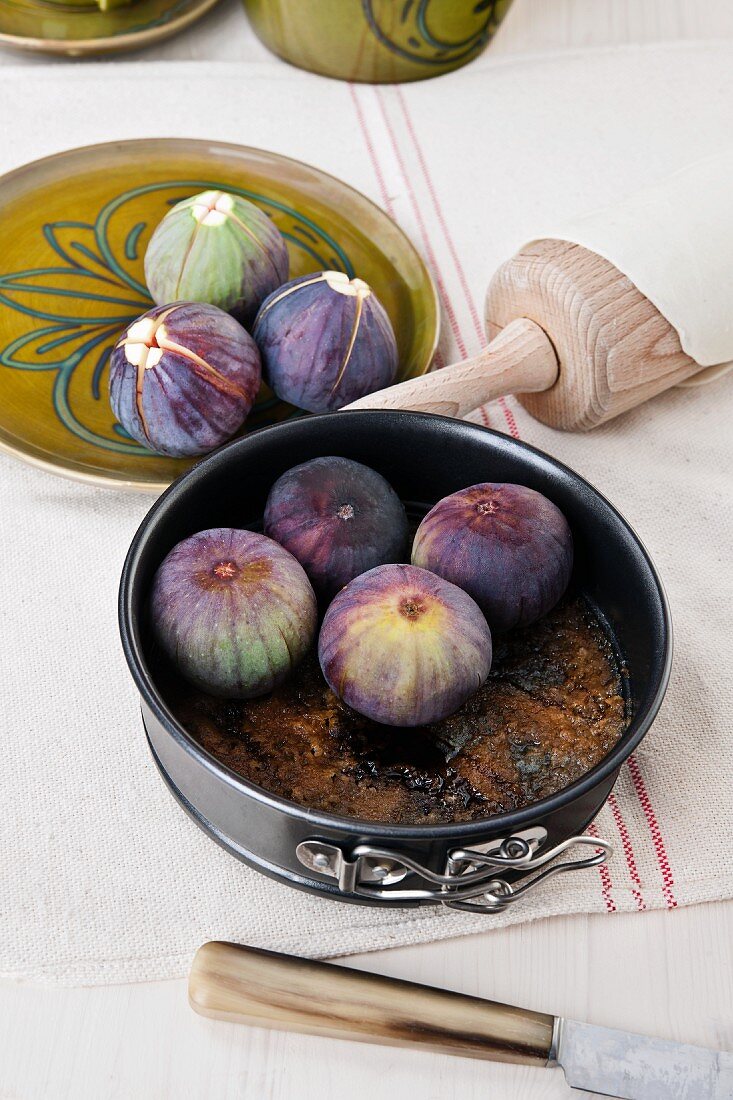 A baking tin with figs (in preparation for fig tarte tatin)