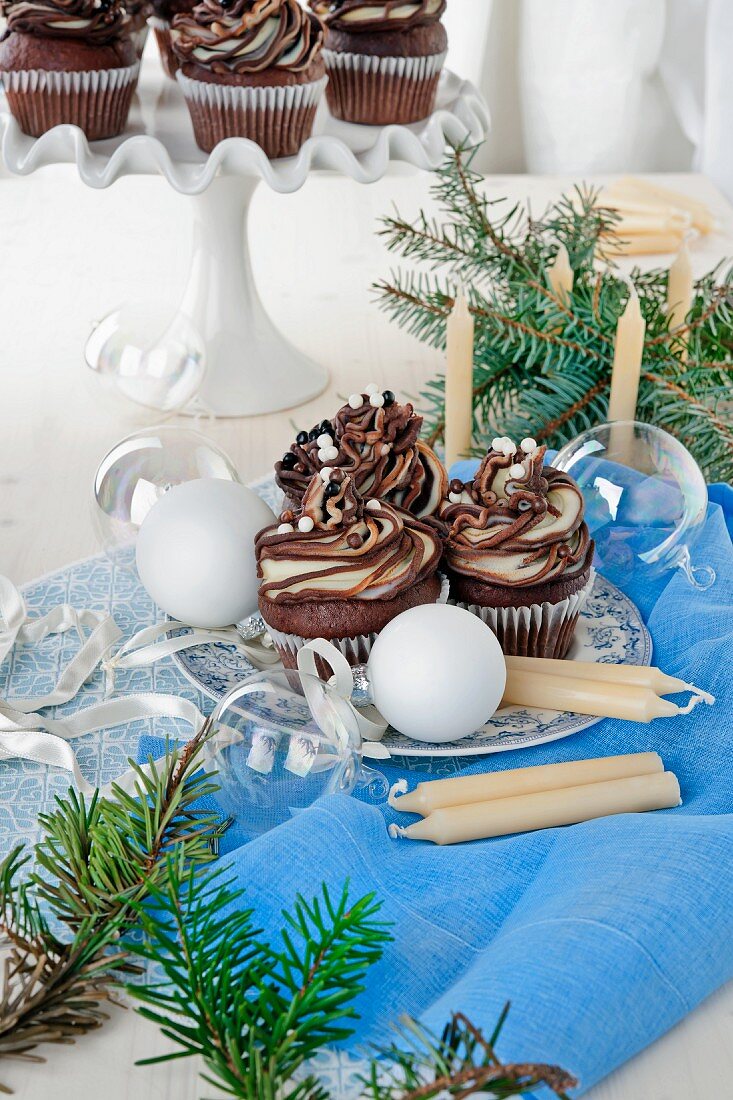 Chocolate cupcakes topped with marbled dark and white chocolate ganache