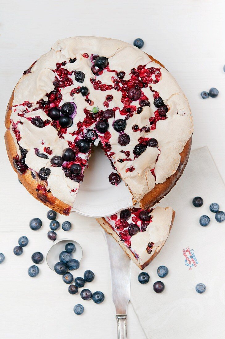 Meringue cake with blueberries and redcurrants