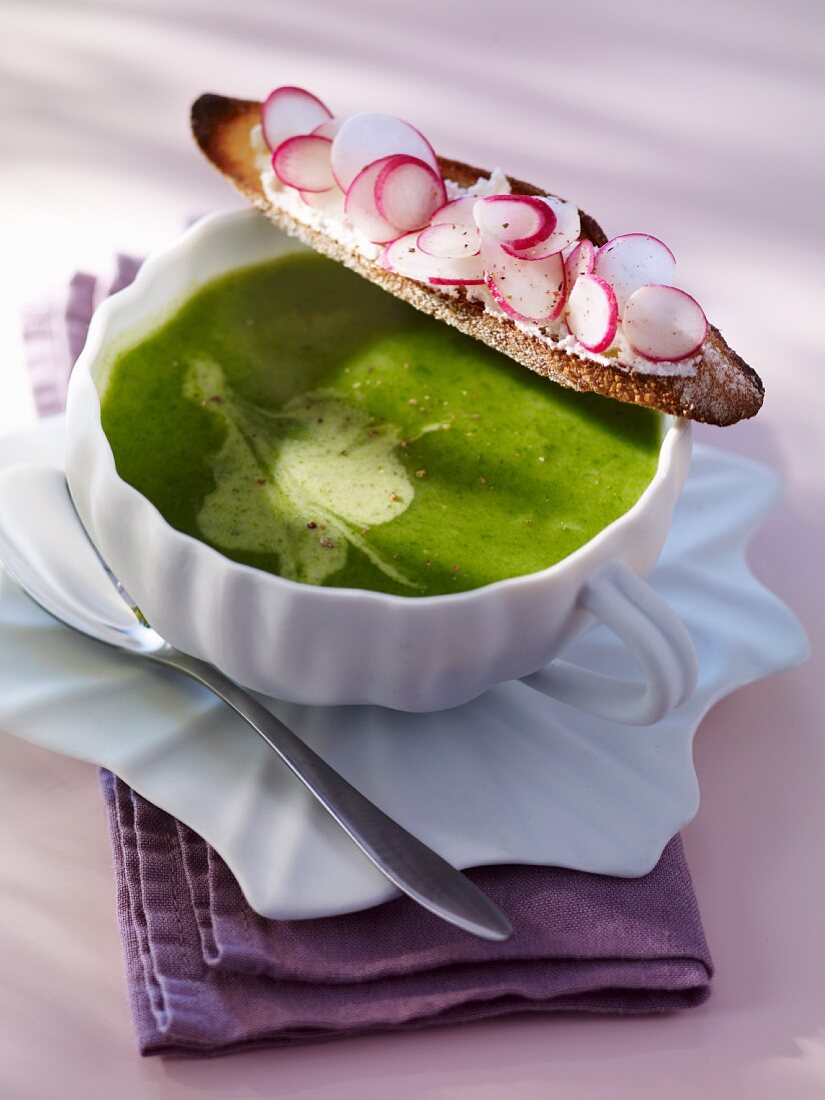 A slice of bread with radishes and radish leaf soup