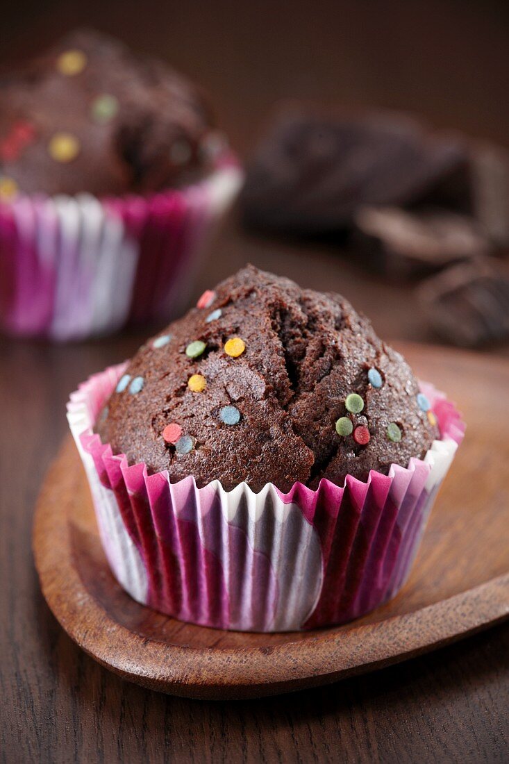 Chocolate muffins with decorative sprinkles