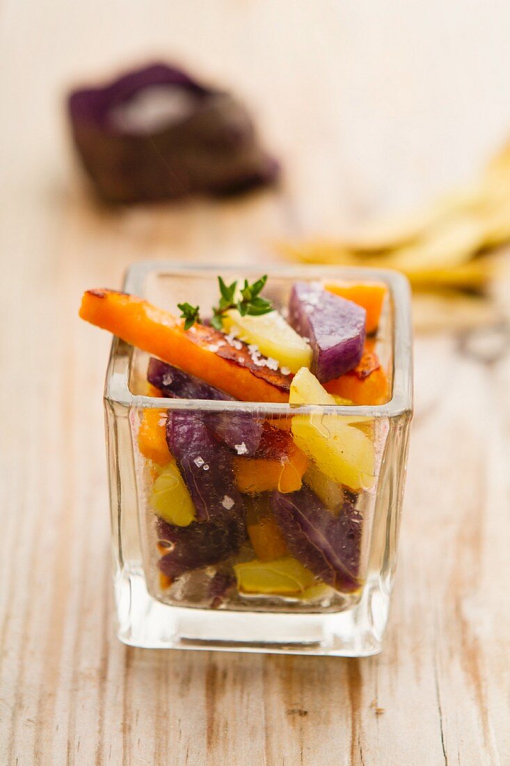 Steamed potatoes and sweet potatoes in a square glass