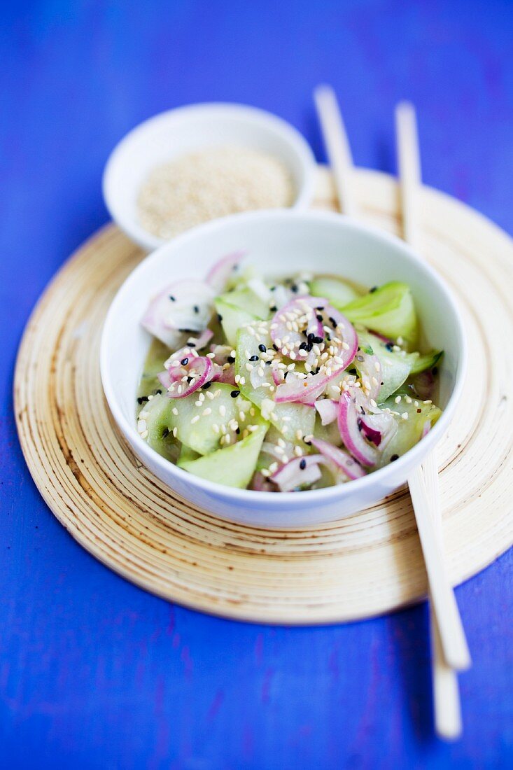 Cucumber salad with red onions and sesame seeds