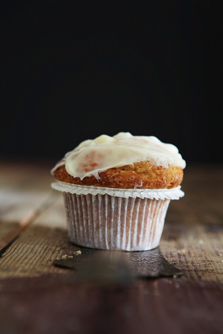 A muffin topped with buttercream