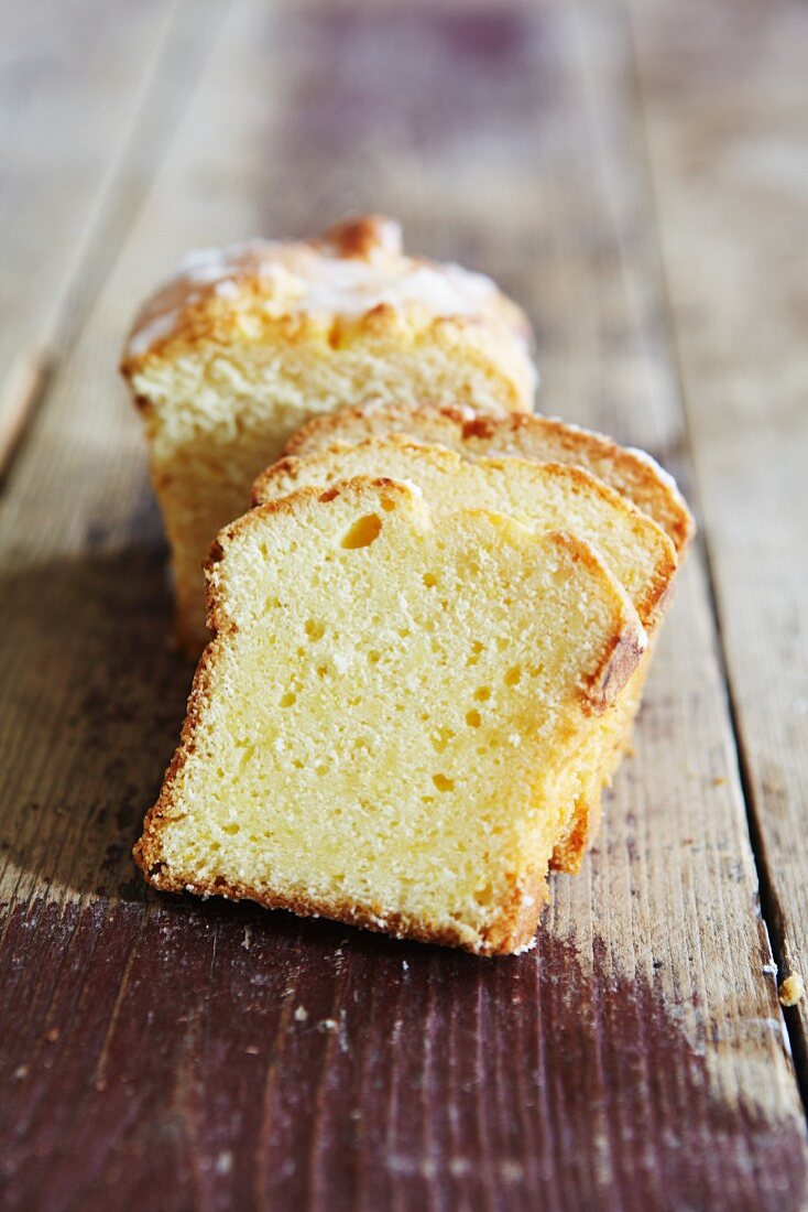 A few slices of lemon cake on a wooden surface