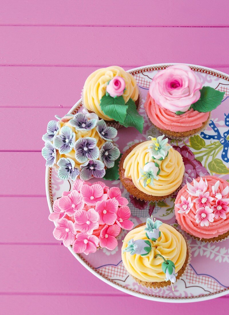 Flower cupcakes on a cake plate