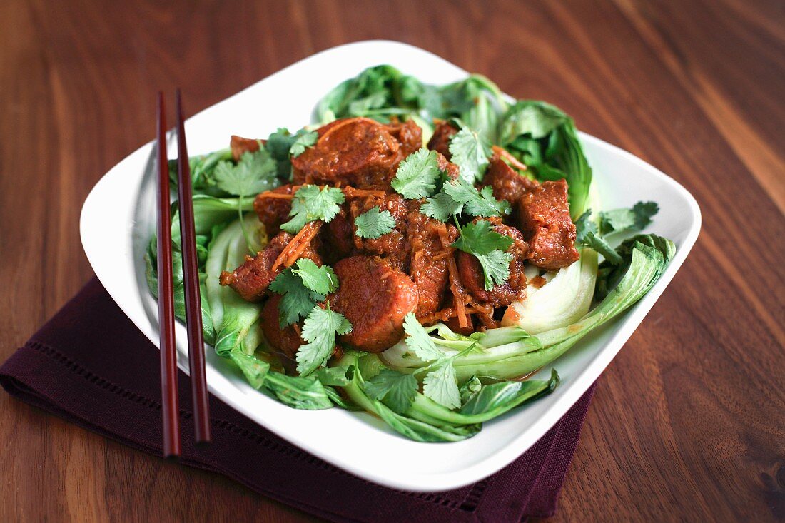 Red pork curry with coriander and pak choi