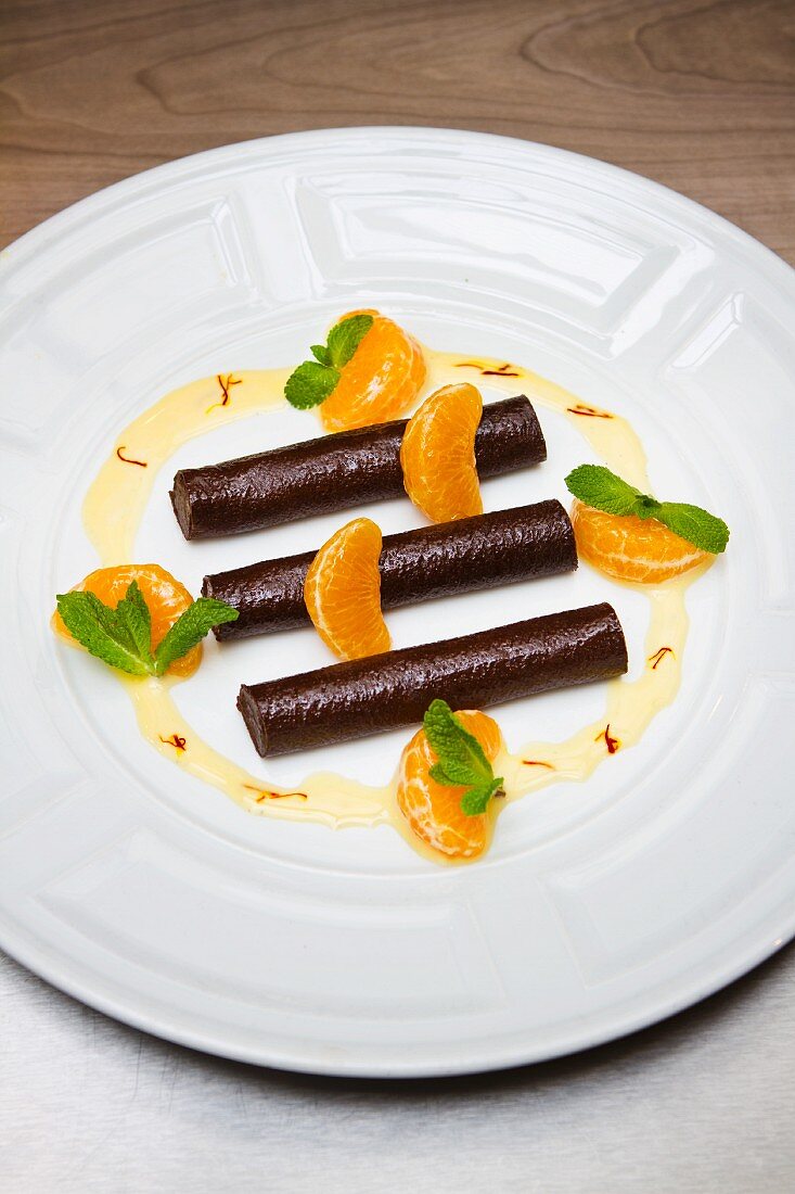 Chocolate rolls with mandarin segments